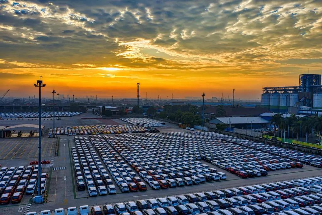cars ready for transport on a parking lot